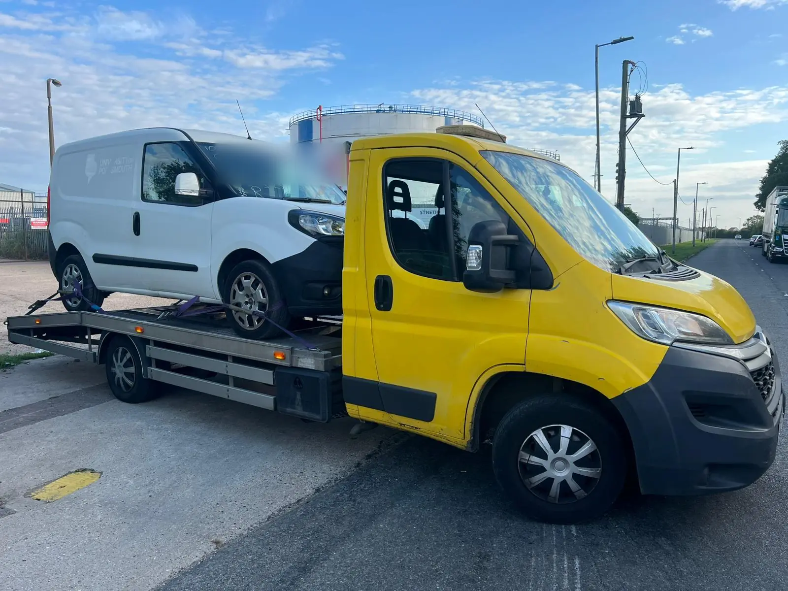 Fiat Doblo van on the yellow truck