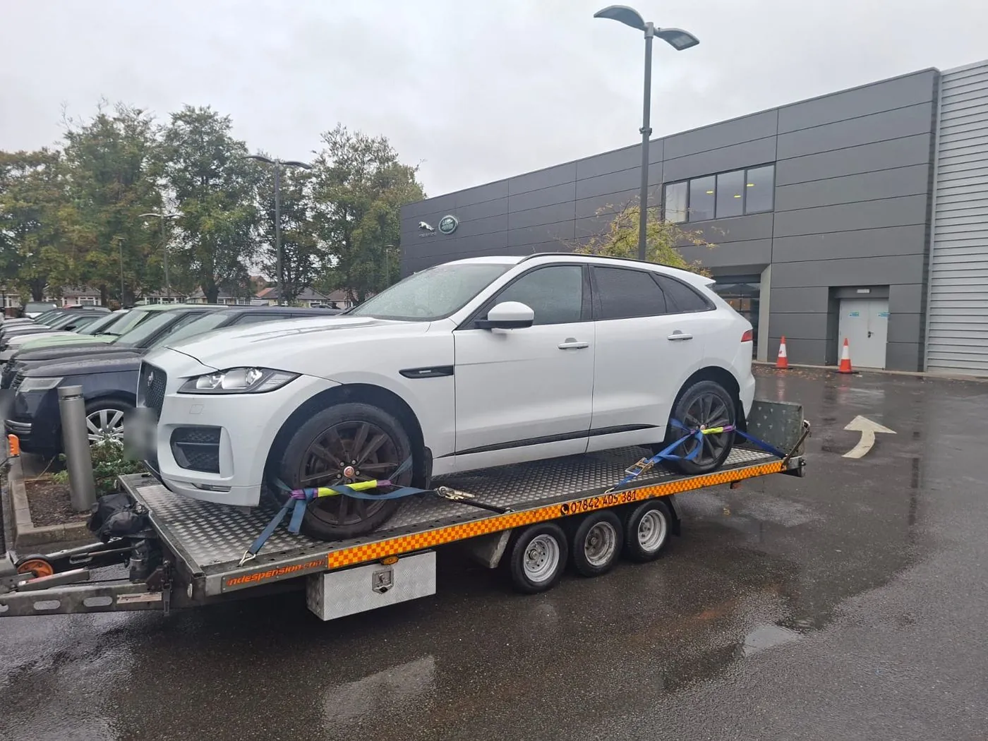 White Jaguar F-Pace on the trailer
