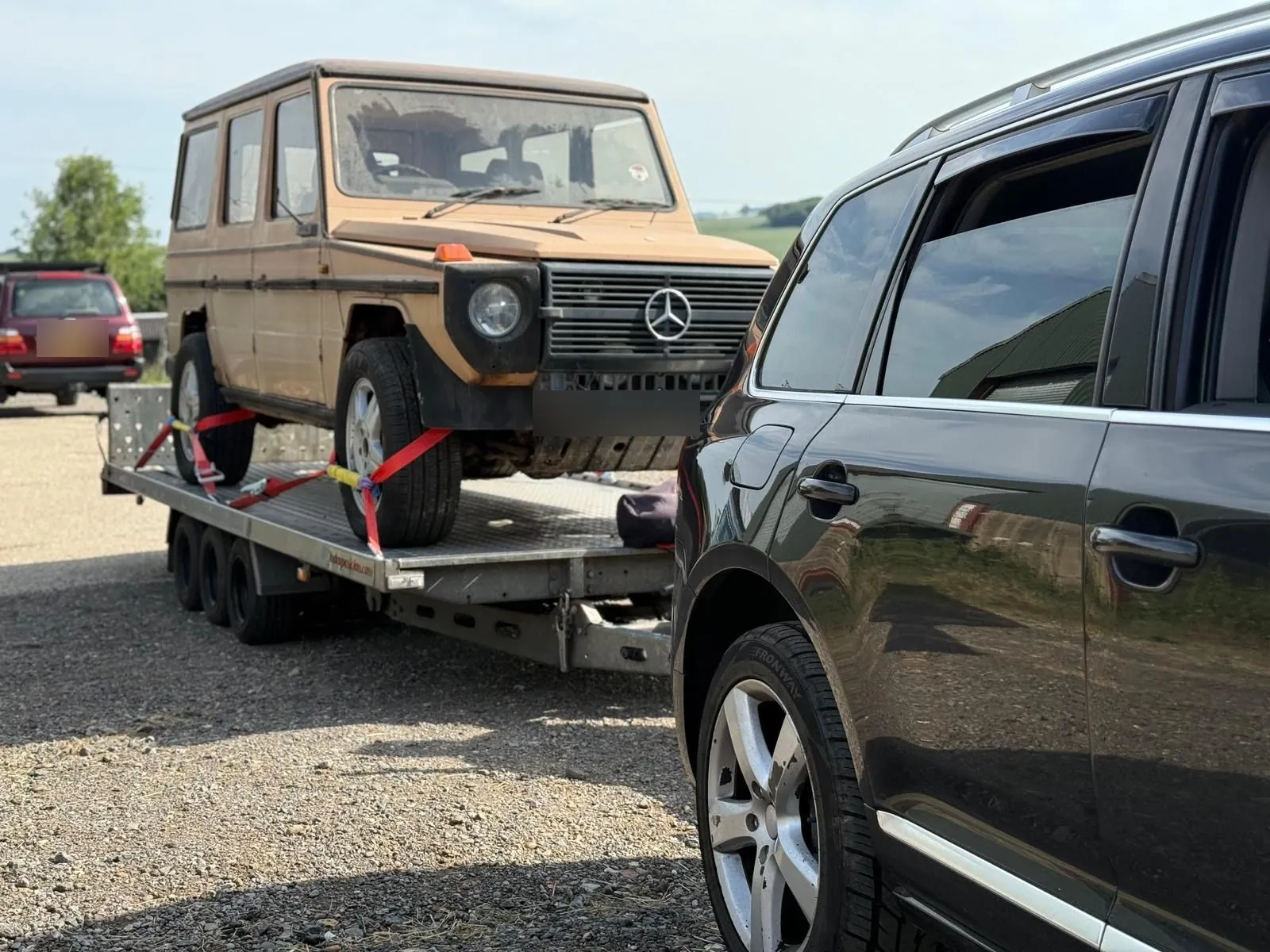 Classic Mercedes G-Wagen on the trailer behind the Touareg