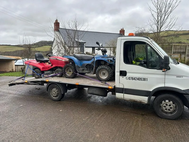 Honda ride-on mower and a quad bike on the white truck